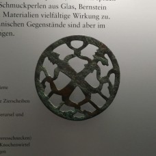 Fertility Amulets, two pierced decorative discs, four-point